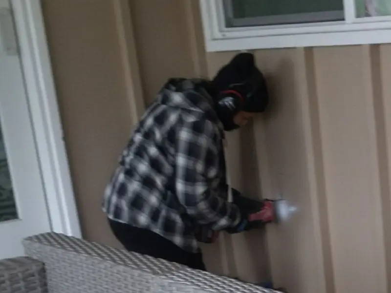 Professional electrician installing an exterior outlet in Ruston